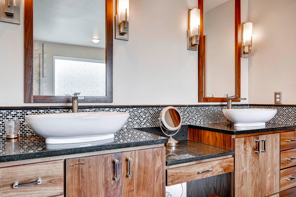 Example of a huge transitional master black tile and stone tile porcelain tile bathroom design in Denver with a vessel sink, flat-panel cabinets, medium tone wood cabinets, quartz countertops, a two-piece toilet and white walls