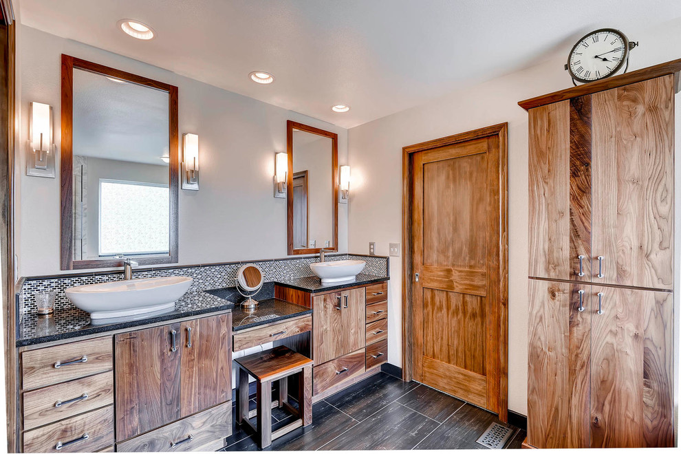 Example of a huge transitional master black tile and stone tile porcelain tile bathroom design in Denver with a vessel sink, flat-panel cabinets, medium tone wood cabinets, quartz countertops, a two-piece toilet and white walls