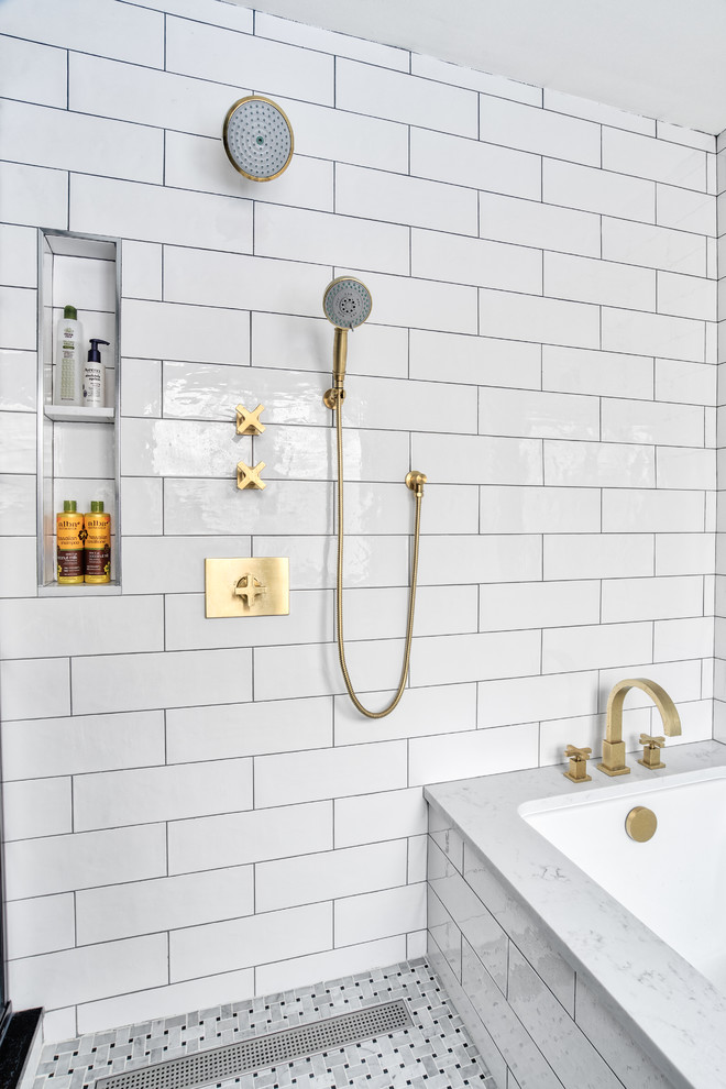 Inspiration for a large modern master white tile and subway tile mosaic tile floor tub/shower combo remodel in New York with shaker cabinets, black cabinets, an undermount tub, a one-piece toilet, white walls, an undermount sink, a hinged shower door and white countertops