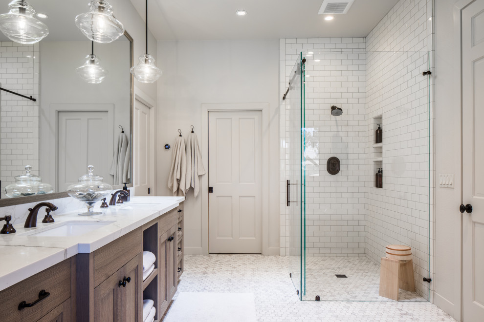 This is an example of a country bathroom in Other with recessed-panel cabinets, medium wood cabinets, white tiles, metro tiles, white walls, mosaic tile flooring, a submerged sink, white floors, white worktops, a wall niche, double sinks and a built in vanity unit.