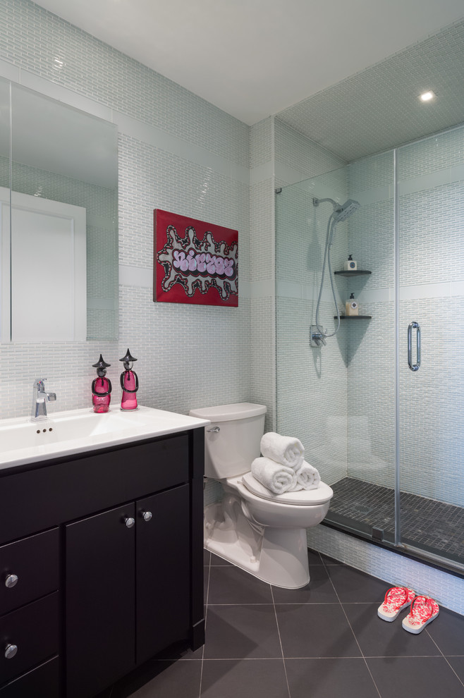 Example of a small trendy master white tile and glass tile porcelain tile double shower design in Other with flat-panel cabinets, dark wood cabinets, a two-piece toilet, white walls, an integrated sink and quartzite countertops