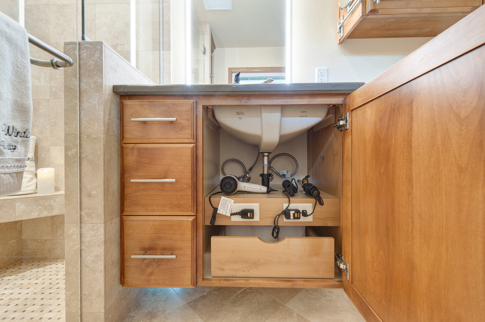 Inspiration for a small timeless master beige tile and travertine tile travertine floor and multicolored floor walk-in shower remodel in Portland with raised-panel cabinets, medium tone wood cabinets, a wall-mount toilet, beige walls, an undermount sink, quartz countertops and a hinged shower door