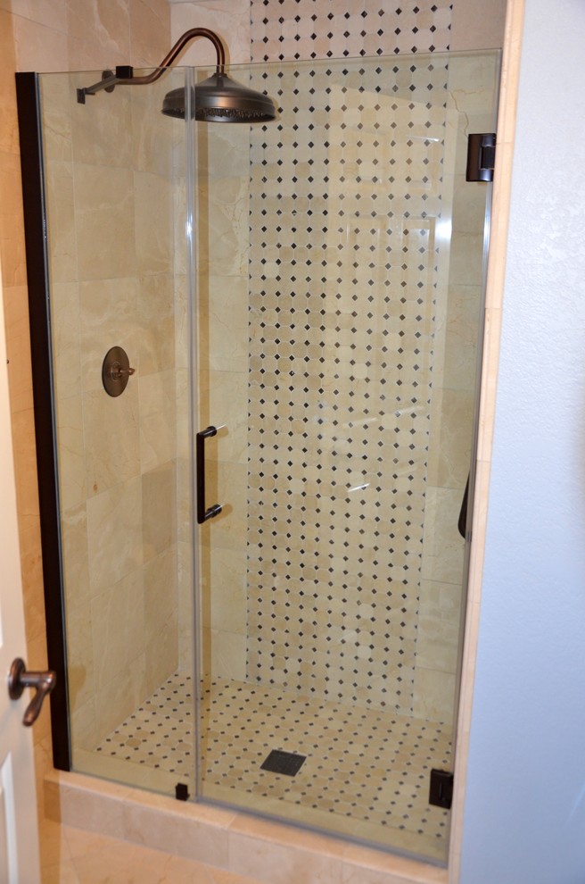 Photo of a small classic shower room bathroom in Los Angeles with a submerged sink, freestanding cabinets, dark wood cabinets, granite worktops, an alcove shower, a two-piece toilet, beige tiles, stone tiles, blue walls, marble flooring, beige floors and a hinged door.