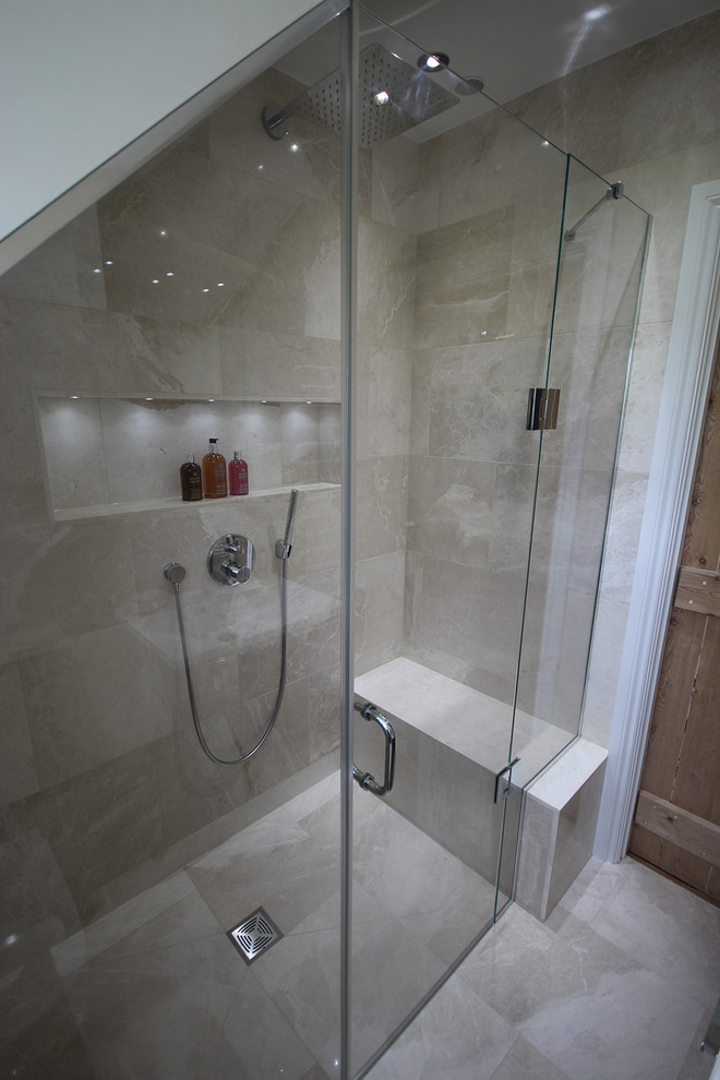 Photo of a small contemporary shower room bathroom in Surrey with a wall-mounted sink, a walk-in shower, a wall mounted toilet, beige tiles, stone tiles, beige walls and marble flooring.
