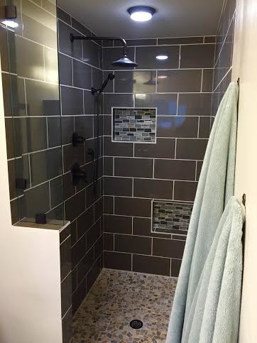 Inspiration for a small contemporary master brown tile and ceramic tile ceramic tile doorless shower remodel in San Diego with a vessel sink, flat-panel cabinets, dark wood cabinets, granite countertops, a two-piece toilet and beige walls