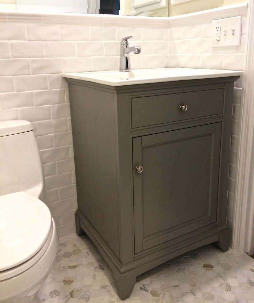 Inspiration for a small classic bathroom in Kansas City with freestanding cabinets, grey cabinets, an alcove bath, a one-piece toilet, white tiles, metro tiles, yellow walls, mosaic tile flooring and a console sink.