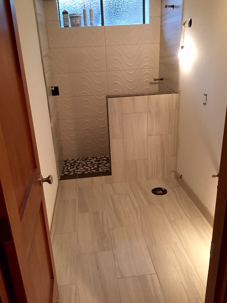 Example of a small trendy 3/4 beige tile and porcelain tile porcelain tile doorless shower design in Seattle with flat-panel cabinets