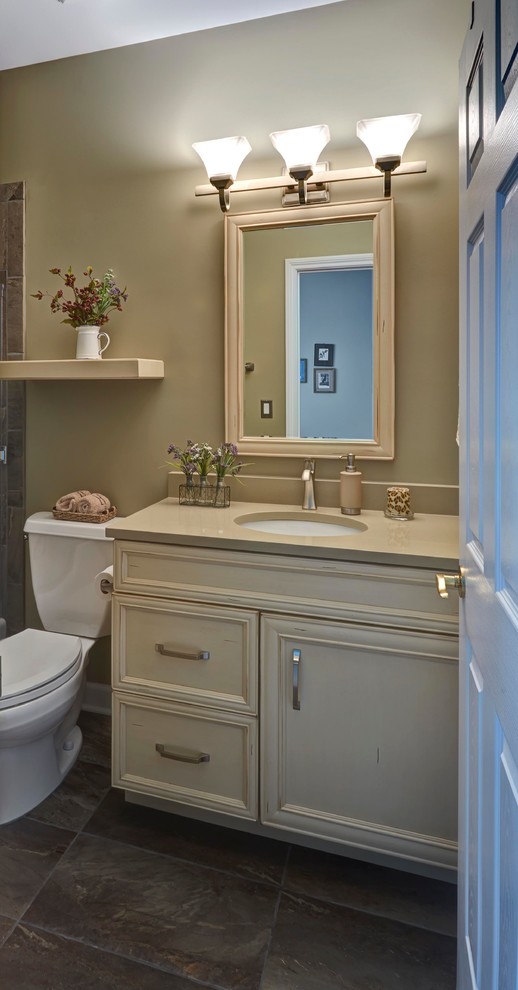 Example of a mid-sized classic bathroom design in Chicago with recessed-panel cabinets and beige cabinets