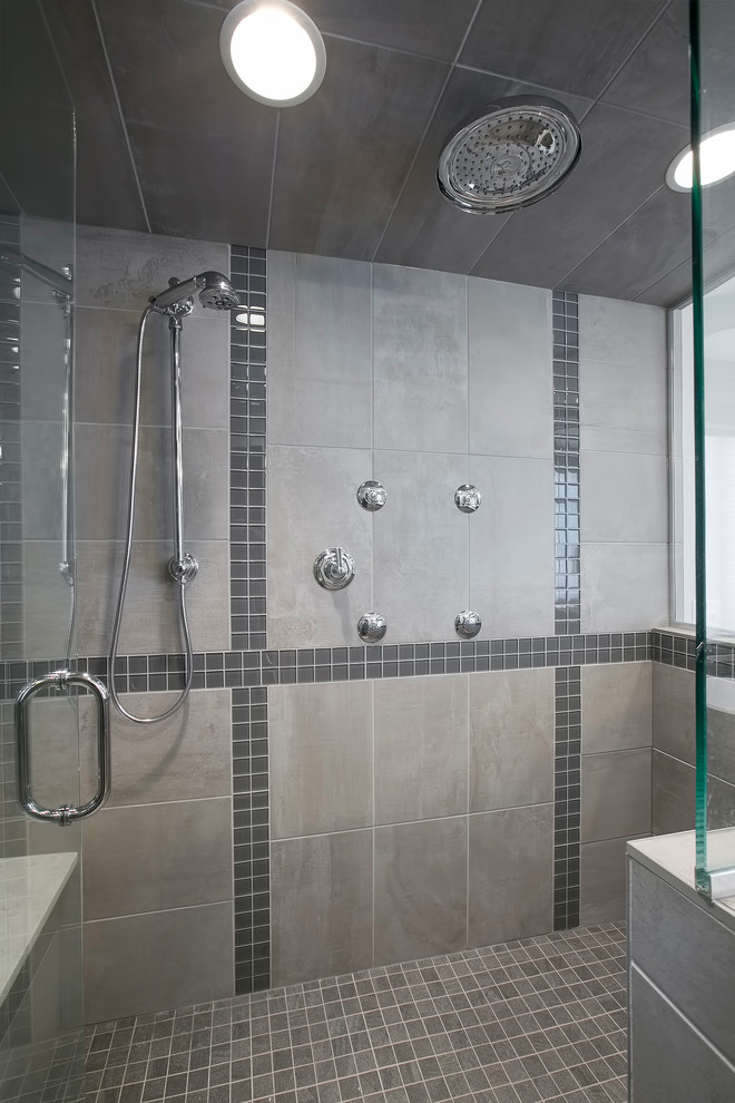 Large transitional master gray tile and porcelain tile medium tone wood floor and brown floor bathroom photo in Minneapolis with shaker cabinets, gray cabinets, gray walls, an undermount sink, quartz countertops, a hinged shower door and white countertops