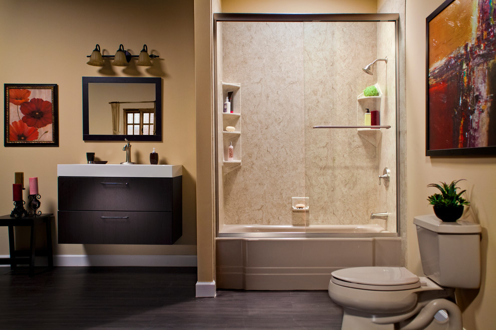 Inspiration for a medium sized contemporary bathroom in Austin with flat-panel cabinets, dark wood cabinets, an alcove bath, a corner shower, a two-piece toilet, brown walls, medium hardwood flooring, an integrated sink, brown floors and a sliding door.