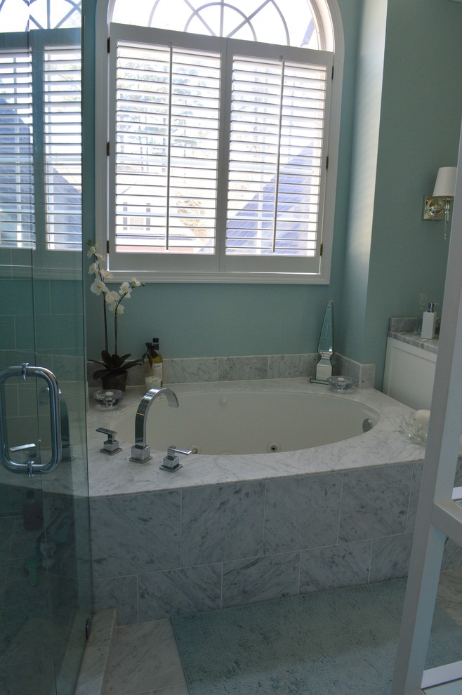 Photo of a contemporary bathroom in Atlanta with a submerged sink, flat-panel cabinets, white cabinets, marble worktops, an alcove bath, a walk-in shower, blue tiles and glass tiles.