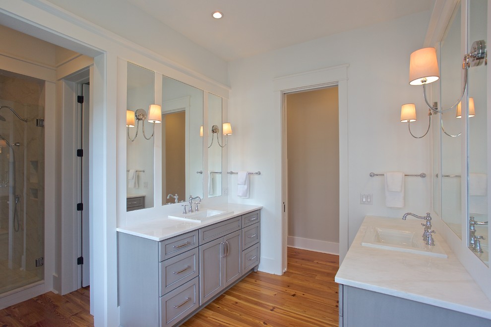 Medium sized classic ensuite bathroom in Charleston with a built-in sink, shaker cabinets, grey cabinets, marble worktops, a freestanding bath, an alcove shower, a two-piece toilet, multi-coloured tiles, porcelain tiles, white walls and medium hardwood flooring.