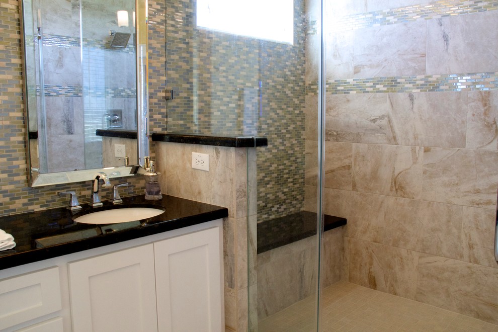 Photo of a large nautical ensuite bathroom in Houston with a submerged sink, shaker cabinets, white cabinets, granite worktops, an alcove shower, a one-piece toilet, yellow walls, travertine flooring, a built-in bath, beige tiles and porcelain tiles.