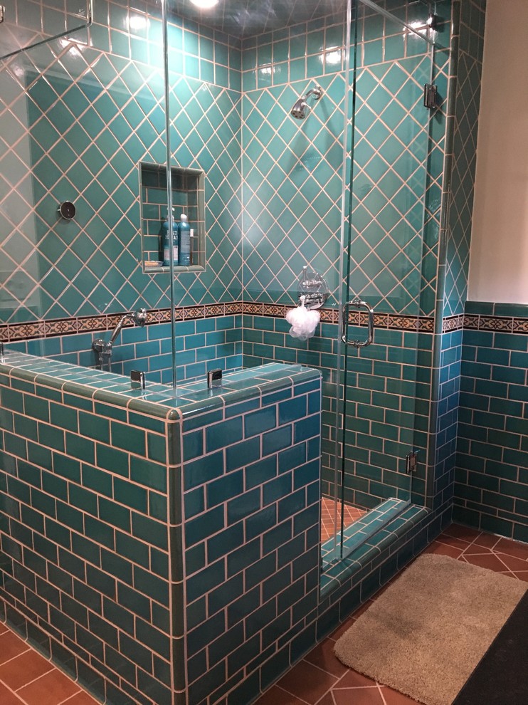 Photo of a medium sized mediterranean ensuite bathroom in Other with shaker cabinets, white cabinets, a freestanding bath, green tiles, beige walls, a submerged sink, soapstone worktops and a corner shower.