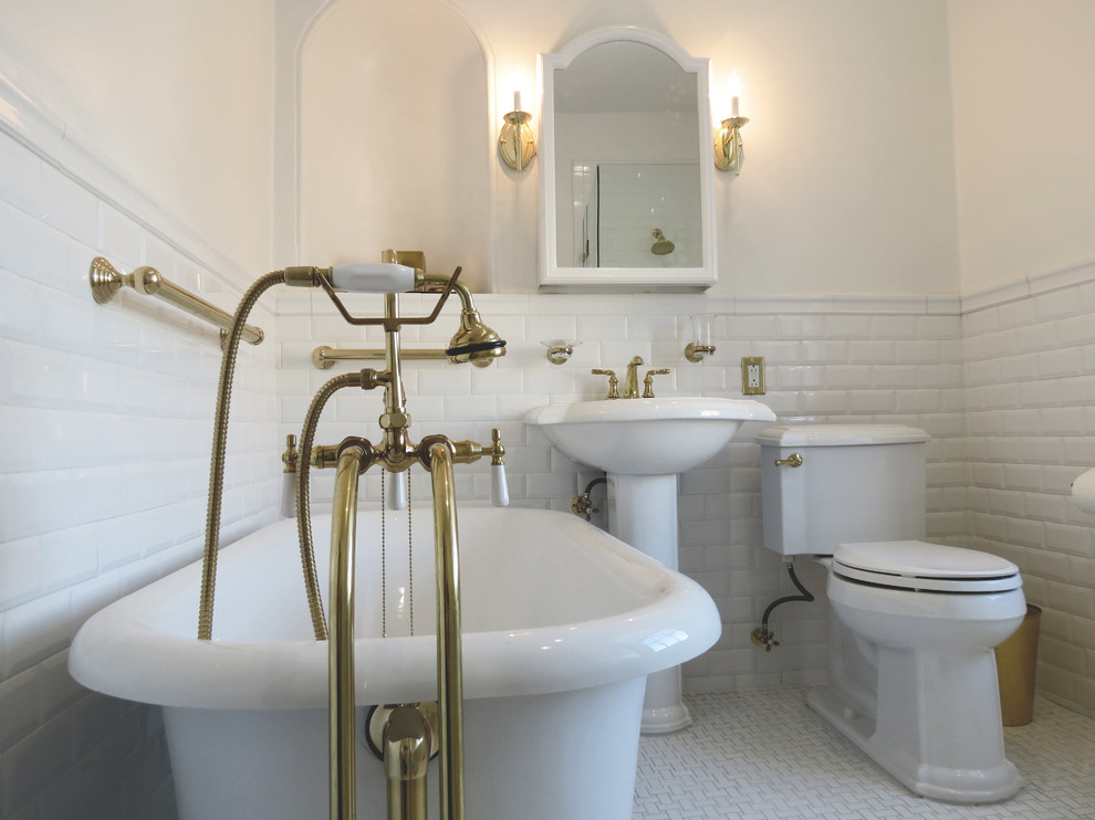 Example of a mid-sized minimalist 3/4 white tile and subway tile white floor freestanding bathtub design in Philadelphia with a two-piece toilet, white walls and a pedestal sink
