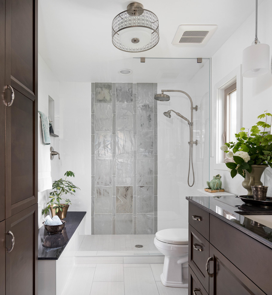 Example of a mid-sized transitional master white tile and glass tile porcelain tile and gray floor bathroom design in Seattle with dark wood cabinets, white walls, an undermount sink and gray countertops