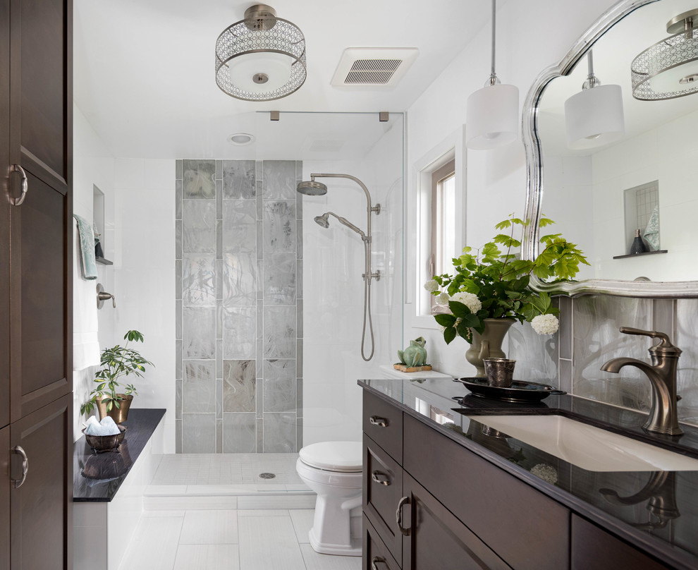 Inspiration for a medium sized traditional ensuite bathroom in Seattle with dark wood cabinets, an alcove shower, white tiles, glass tiles, white walls, porcelain flooring, a submerged sink, grey floors, an open shower and grey worktops.