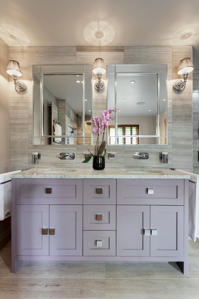 Inspiration for a large classic grey and purple ensuite bathroom in Sussex with flat-panel cabinets, light wood cabinets, a freestanding bath, a walk-in shower, grey tiles, stone slabs, grey walls, limestone flooring, marble worktops and a submerged sink.