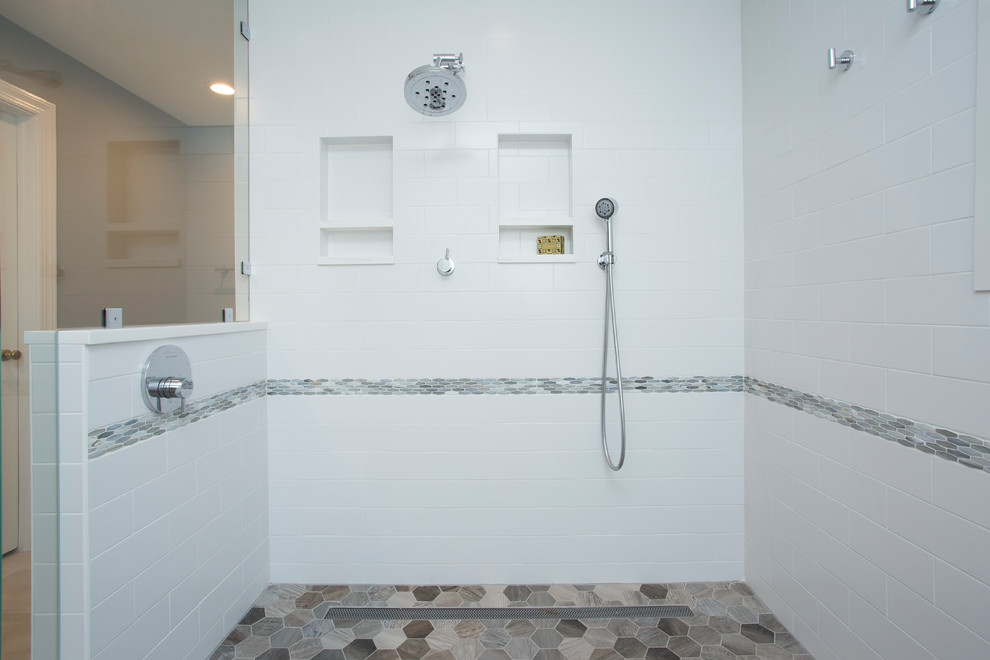 Inspiration for a large classic ensuite wet room bathroom in Raleigh with shaker cabinets, grey cabinets, a freestanding bath, a two-piece toilet, white tiles, ceramic tiles, blue walls, porcelain flooring, a submerged sink, engineered stone worktops, grey floors, a hinged door and white worktops.