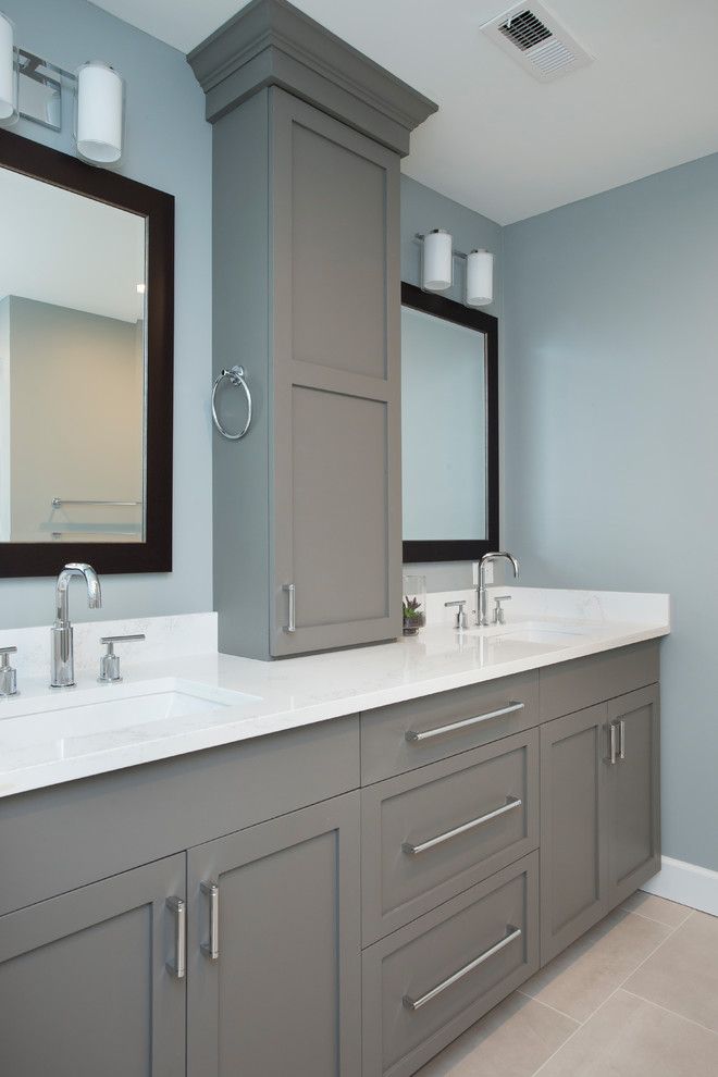 Large transitional master white tile and ceramic tile porcelain tile and gray floor bathroom photo in Raleigh with shaker cabinets, gray cabinets, a two-piece toilet, blue walls, an undermount sink, quartz countertops, a hinged shower door and white countertops