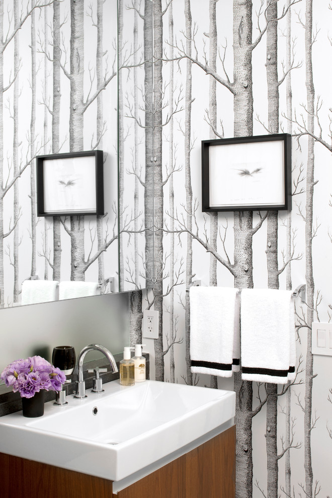 Immagine di una stanza da bagno design con lavabo a consolle