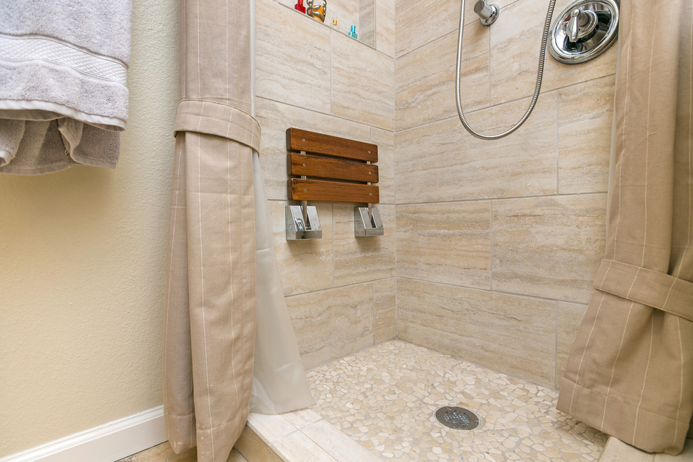 Example of a large zen master beige tile and travertine tile porcelain tile bathroom design in San Diego with recessed-panel cabinets, light wood cabinets, a two-piece toilet, beige walls, a vessel sink and granite countertops