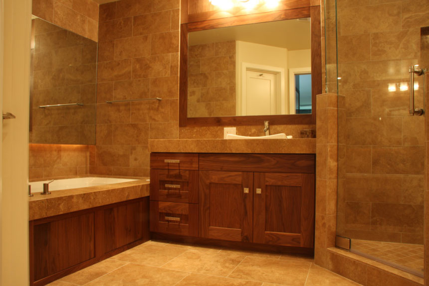 Photo of a large contemporary ensuite bathroom in San Diego with shaker cabinets, brown cabinets, a corner shower, marble tiles, beige walls, marble flooring, a built-in sink, marble worktops, beige floors and a hinged door.