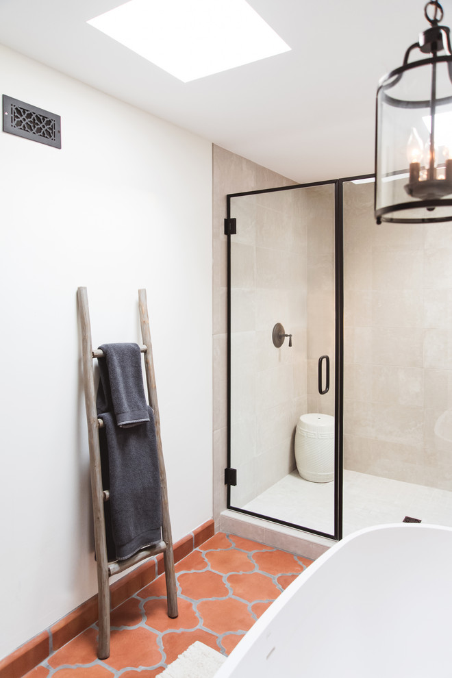 Expansive ensuite bathroom in San Diego with raised-panel cabinets, medium wood cabinets, a freestanding bath, an alcove shower, multi-coloured tiles, ceramic tiles, white walls, terracotta flooring, a vessel sink, orange floors, a hinged door and grey worktops.