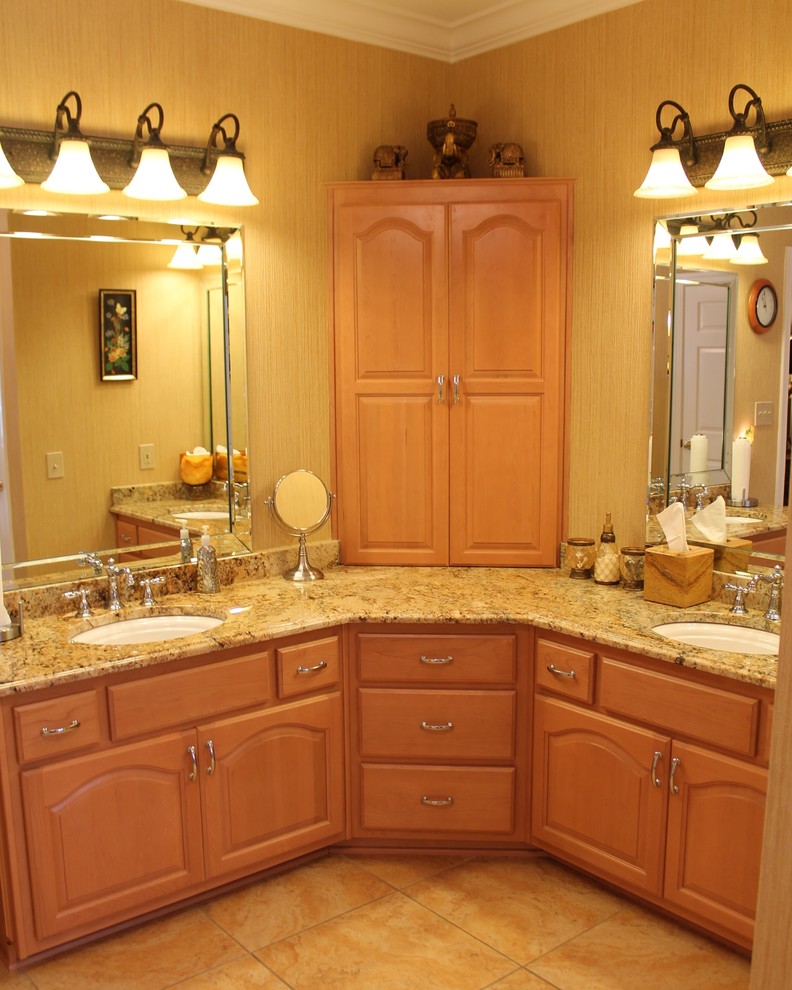 This is an example of a medium sized classic ensuite bathroom in Atlanta with raised-panel cabinets, light wood cabinets, granite worktops, brown walls, a submerged sink and beige floors.