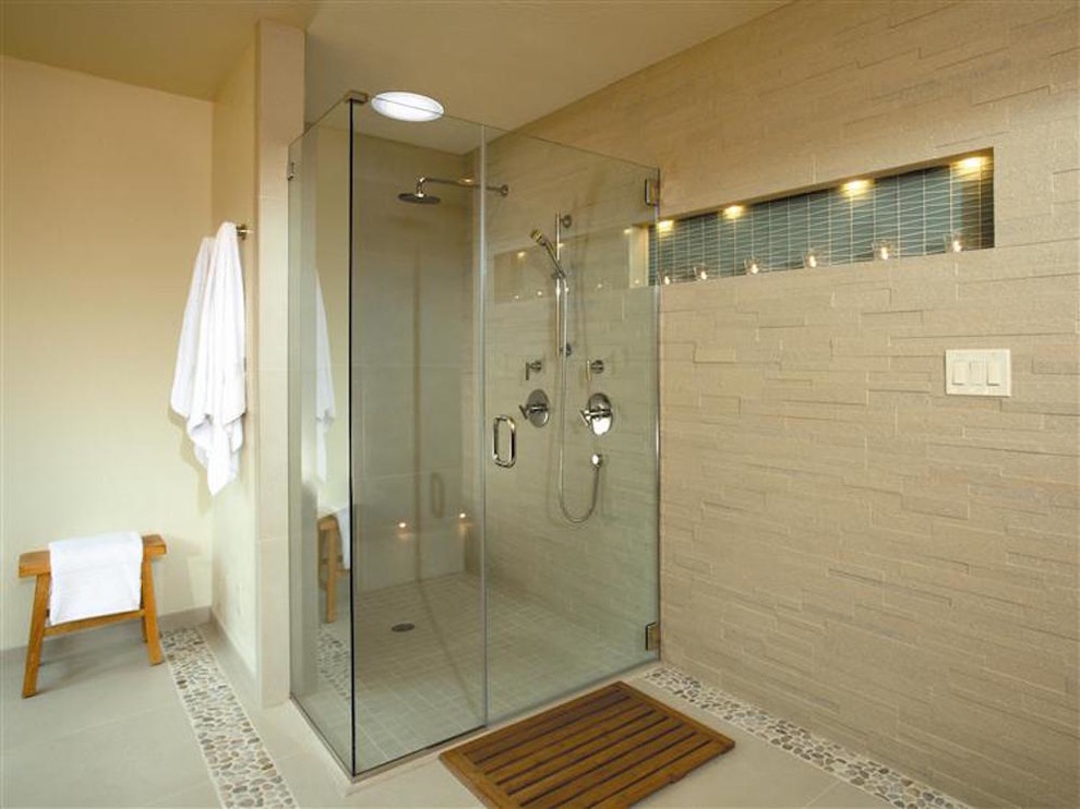 Design ideas for a large world-inspired ensuite bathroom in Los Angeles with a built-in bath, an alcove shower, beige tiles, blue tiles, stone tiles, beige walls, porcelain flooring, granite worktops, beige floors and a hinged door.