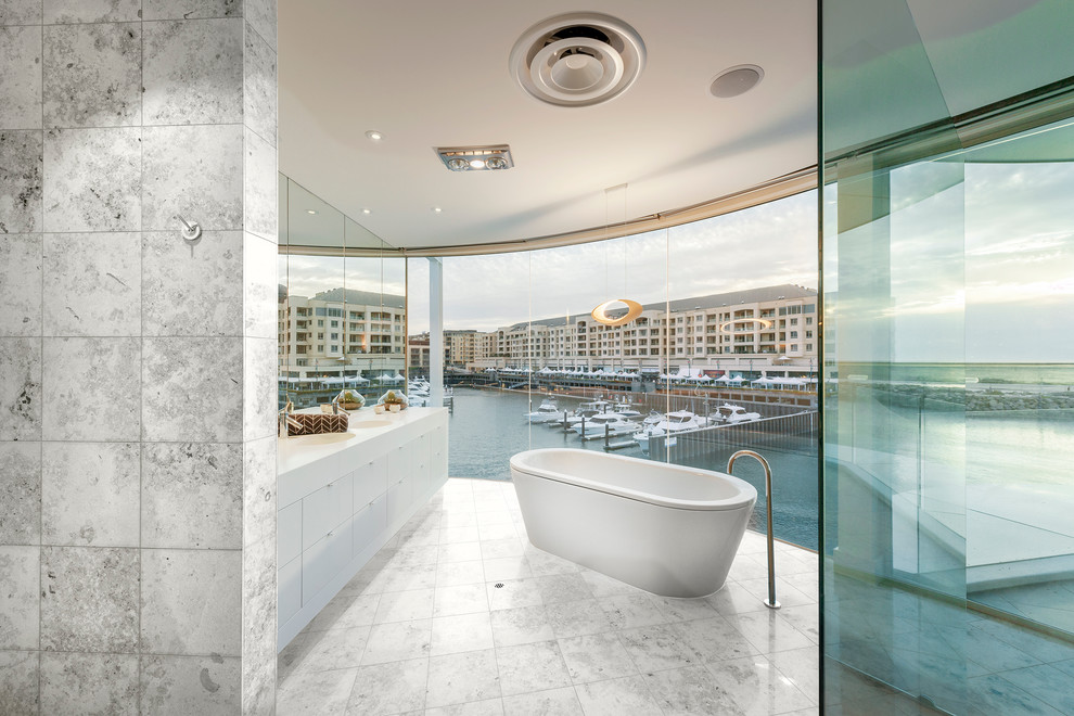 Example of a mid-sized trendy master freestanding bathtub design in Adelaide with flat-panel cabinets and white cabinets