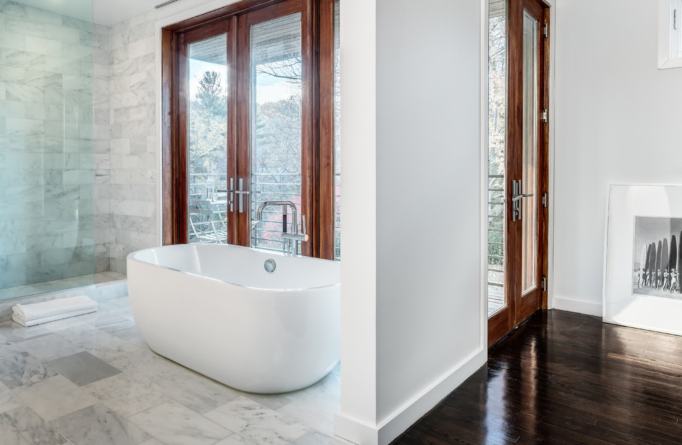 Example of a mid-sized minimalist master white tile and stone tile marble floor bathroom design in DC Metro with a vessel sink, flat-panel cabinets, white cabinets, marble countertops, a one-piece toilet and white walls