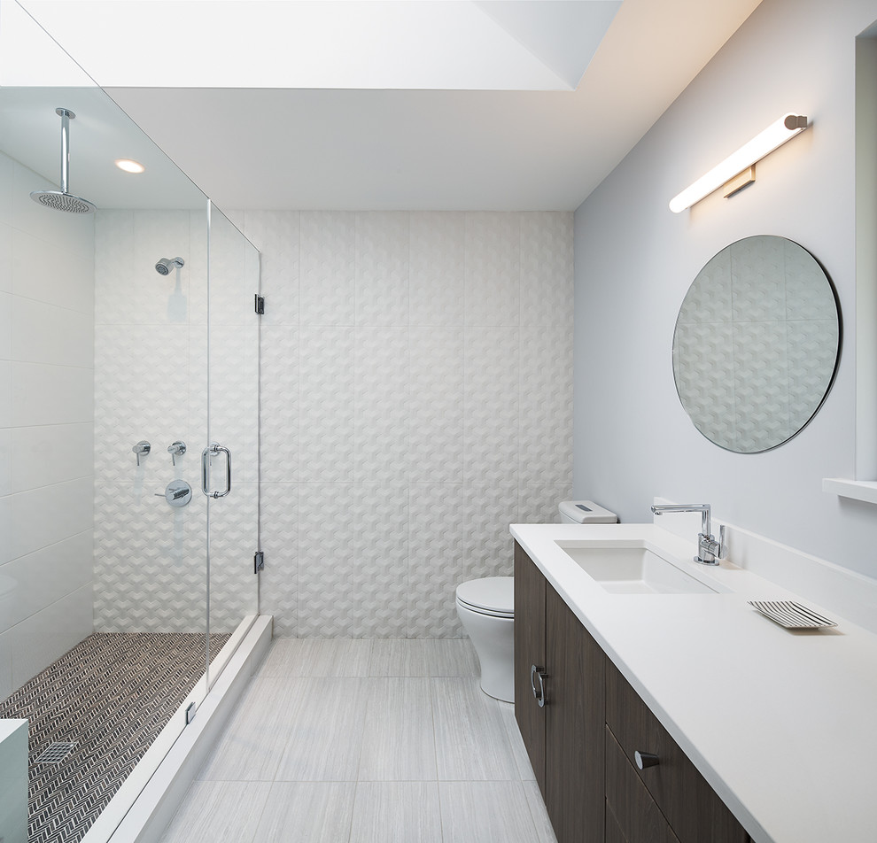 Inspiration for a mid-sized mid-century modern master gray tile and ceramic tile porcelain tile and gray floor alcove shower remodel in DC Metro with flat-panel cabinets, dark wood cabinets, white walls, an undermount sink, quartz countertops and a hinged shower door