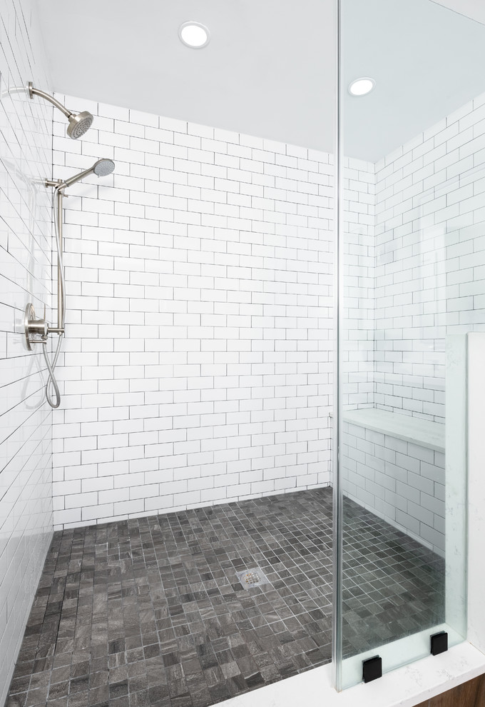 Photo of a medium sized traditional shower room bathroom in DC Metro with recessed-panel cabinets, grey cabinets, an alcove shower, a two-piece toilet, white tiles, metro tiles, white walls, a submerged sink, engineered stone worktops, brown floors, a hinged door and white worktops.
