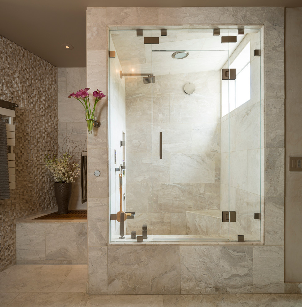 Réalisation d'une douche en alcôve principale tradition en bois brun avec un lavabo intégré, un placard à porte plane, un plan de toilette en verre, un bidet, un carrelage beige, un carrelage de pierre, un mur beige et un sol en marbre.