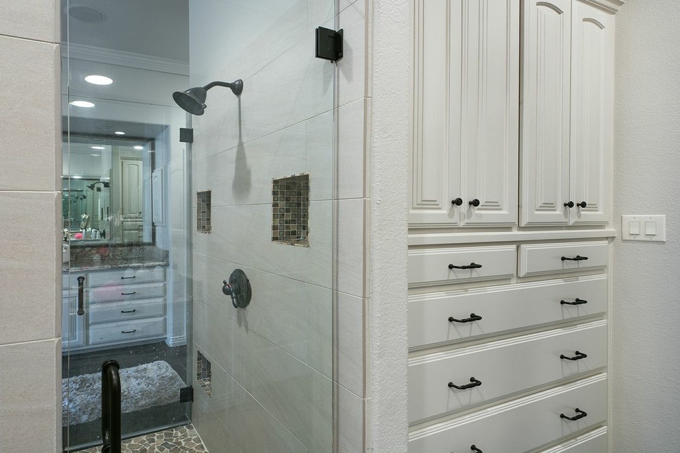 Large classic ensuite bathroom in Austin with a submerged sink, beaded cabinets, white cabinets, granite worktops, a built-in bath, an alcove shower, a two-piece toilet, beige tiles, mosaic tiles, beige walls and porcelain flooring.
