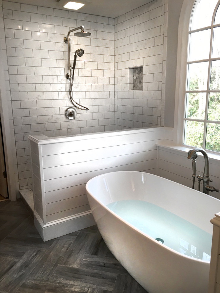 Inspiration for a mid-sized farmhouse master white tile and ceramic tile ceramic tile and gray floor bathroom remodel in Atlanta with shaker cabinets, gray cabinets, a two-piece toilet, gray walls, an undermount sink, marble countertops and a hinged shower door