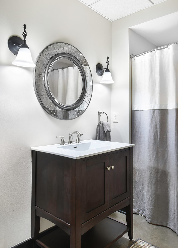 Inspiration for a small classic ensuite bathroom in Atlanta with recessed-panel cabinets, medium wood cabinets, an alcove shower, a one-piece toilet, white walls, an integrated sink, an alcove bath, concrete flooring, grey floors and a shower curtain.