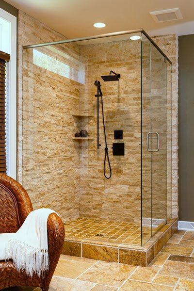 Inspiration for a large transitional master beige tile and stone tile porcelain tile and beige floor corner shower remodel in Other with gray walls and a hinged shower door