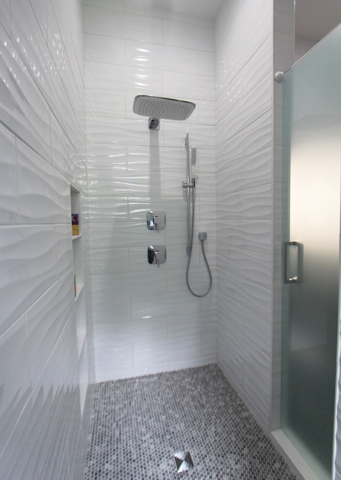 Double shower - mid-sized contemporary kids' white tile and ceramic tile porcelain tile and gray floor double shower idea in Atlanta with beaded inset cabinets, dark wood cabinets, a two-piece toilet, gray walls, a vessel sink, quartz countertops, a hinged shower door and white countertops