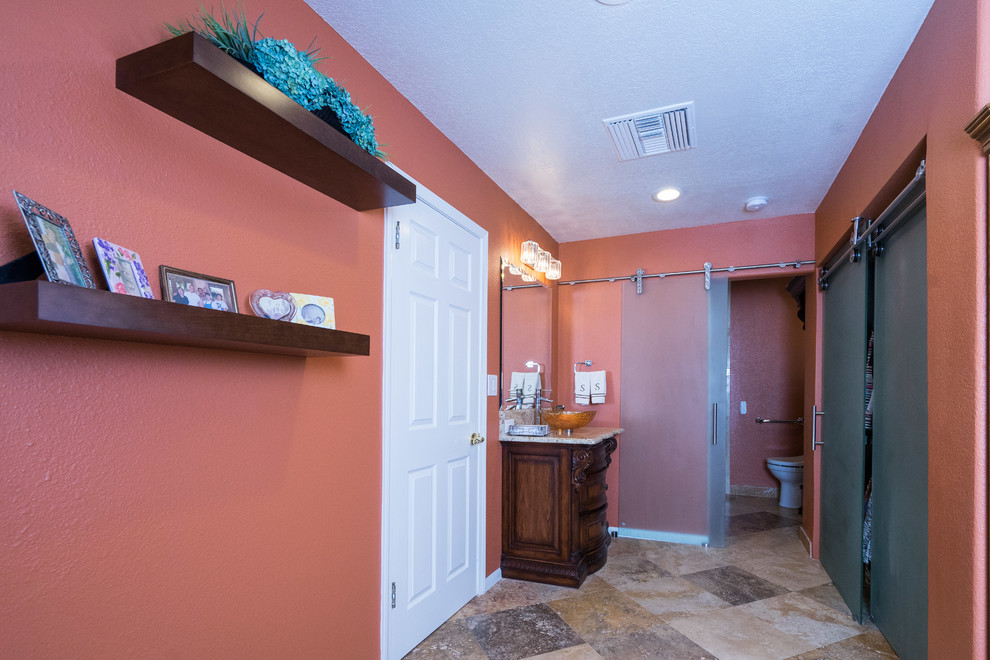 Cette photo montre une salle d'eau chic en bois foncé de taille moyenne avec un placard en trompe-l'oeil, un mur orange, un sol en carrelage de céramique, une vasque, un plan de toilette en granite et WC séparés.