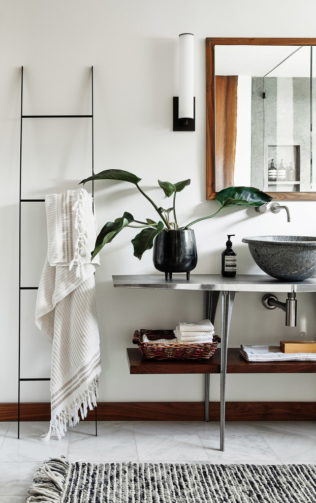 Inspiration for a contemporary white floor bathroom remodel in San Francisco with open cabinets, white walls, a vessel sink, stainless steel countertops and gray countertops