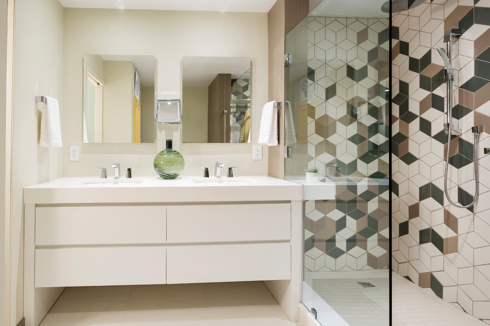 Inspiration for a large transitional master multicolored tile and porcelain tile ceramic tile and white floor bathroom remodel in Philadelphia with flat-panel cabinets, white cabinets, a two-piece toilet, white walls, an undermount sink, quartzite countertops and white countertops