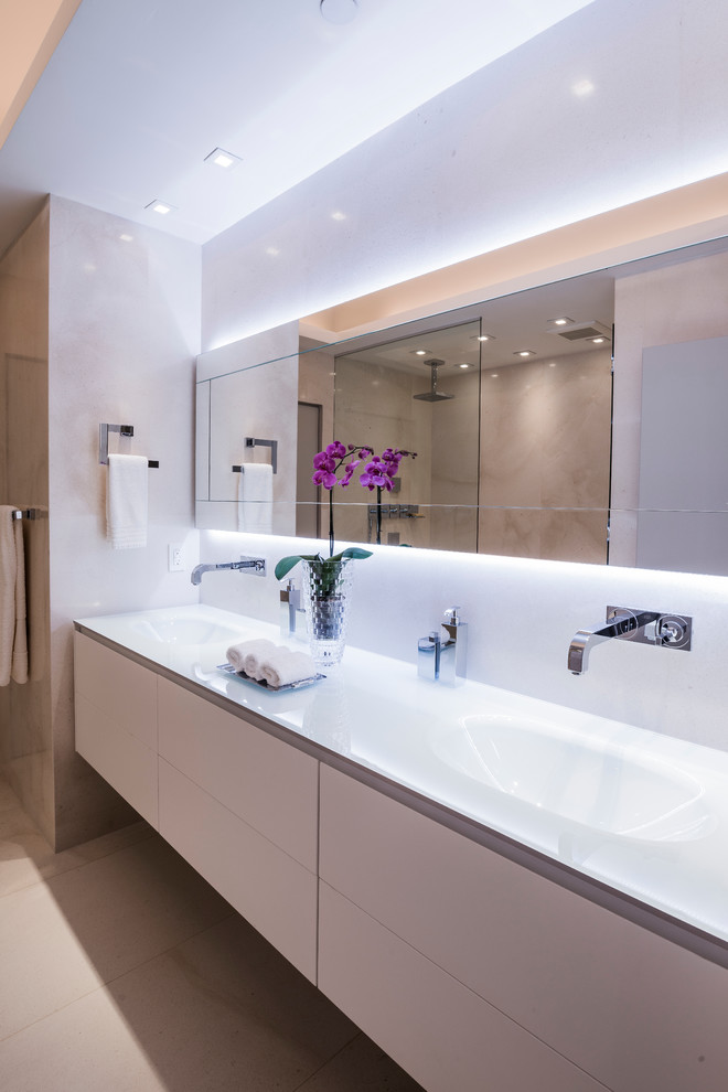 Design ideas for a large contemporary ensuite bathroom in Miami with flat-panel cabinets, beige cabinets, a walk-in shower, a one-piece toilet, white tiles, beige walls, ceramic flooring, a built-in sink, glass worktops, beige floors and an open shower.