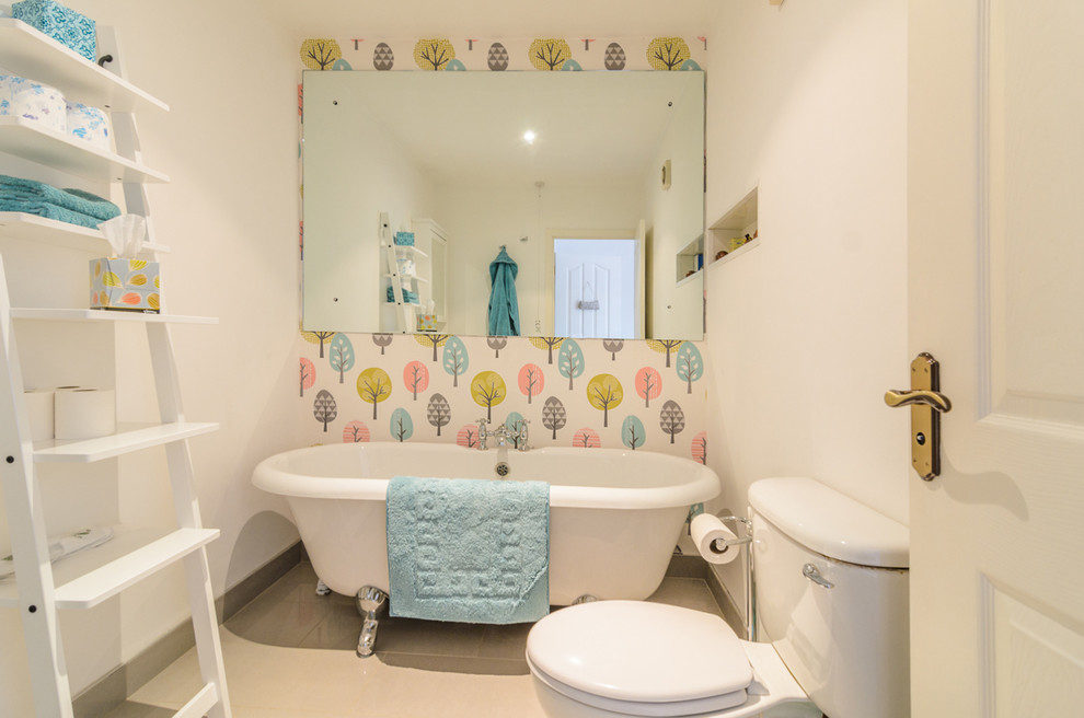 Small trendy claw-foot bathtub photo in Belfast with multicolored walls
