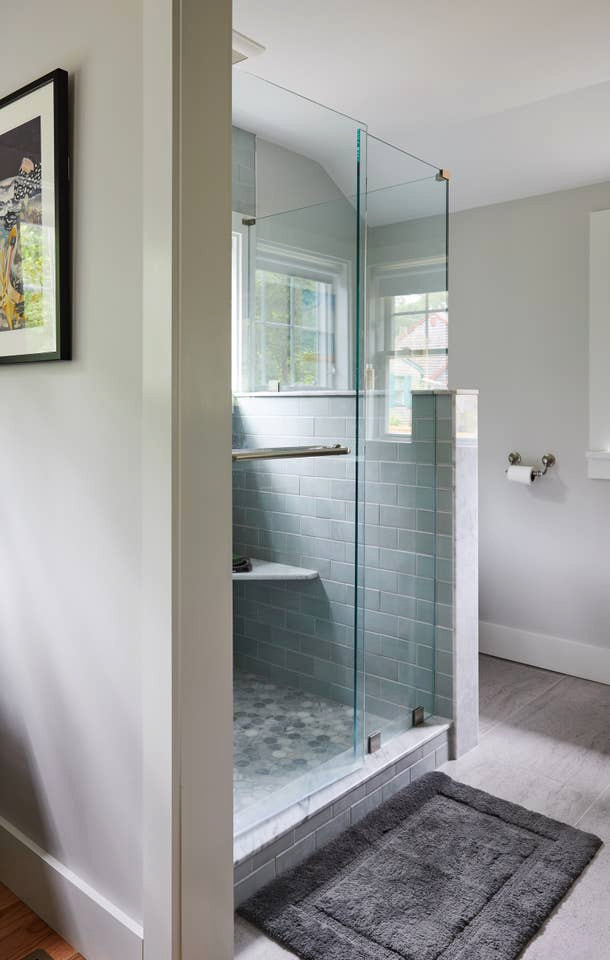 Alcove shower - large coastal blue tile and glass tile ceramic tile and gray floor alcove shower idea in Providence with gray walls, marble countertops, a hinged shower door and white countertops