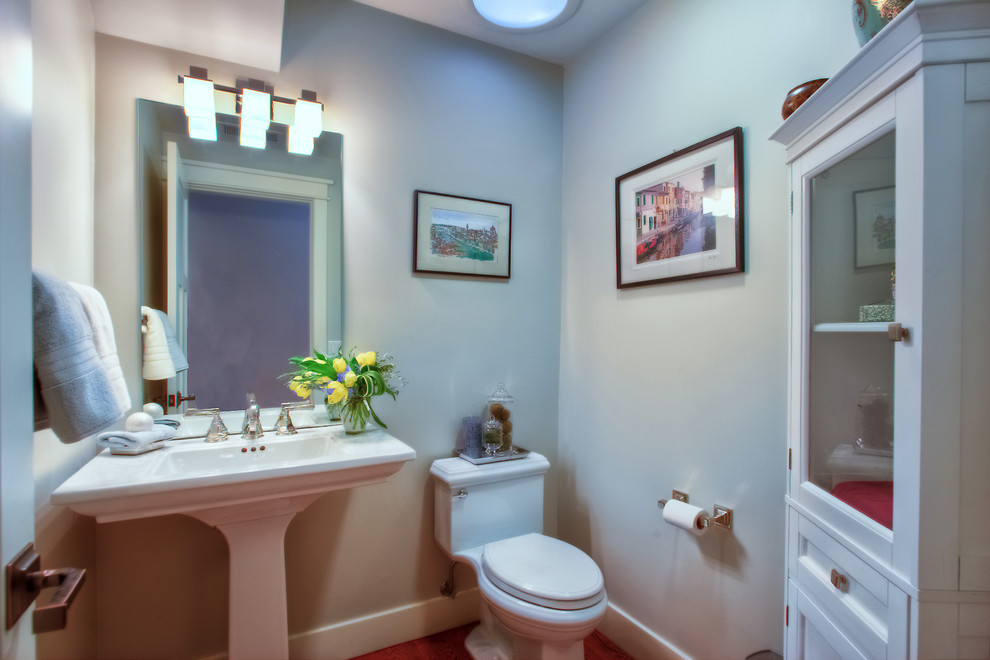 Small classic shower room bathroom in San Francisco with a pedestal sink, shaker cabinets, white cabinets, green walls and medium hardwood flooring.