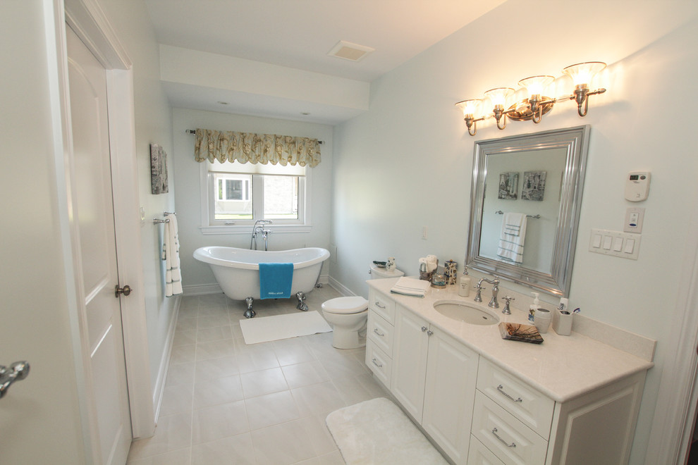 Mid-sized elegant kids' white tile and ceramic tile ceramic tile bathroom photo in Ottawa with raised-panel cabinets, white cabinets, a two-piece toilet, an undermount sink and granite countertops