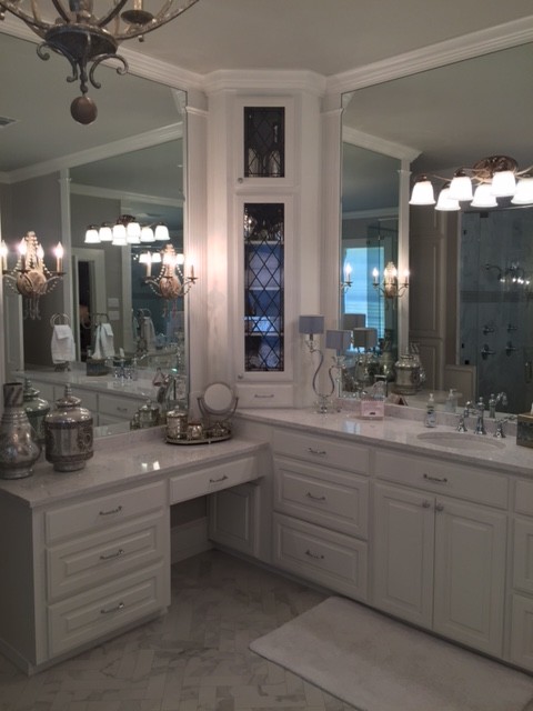 Large victorian ensuite bathroom in New Orleans with recessed-panel cabinets, white cabinets, grey tiles, white walls, marble flooring, a built-in sink and marble worktops.