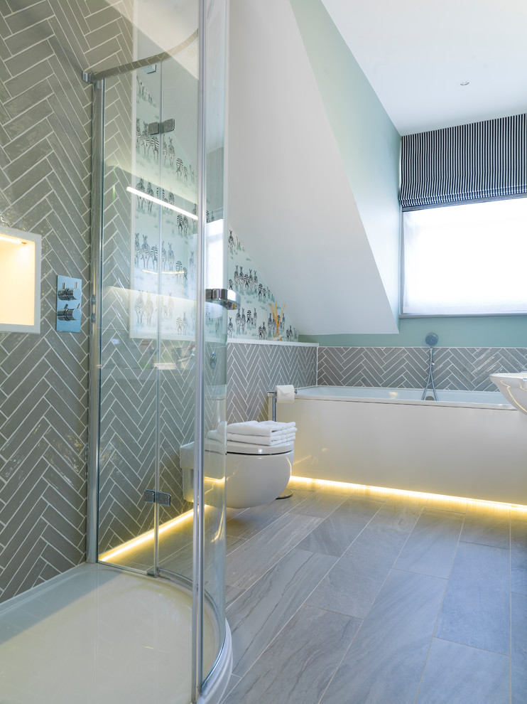 This is an example of a medium sized contemporary bathroom in Other with a wall mounted toilet, grey tiles, grey floors, a built-in bath, a corner shower and ceramic tiles.
